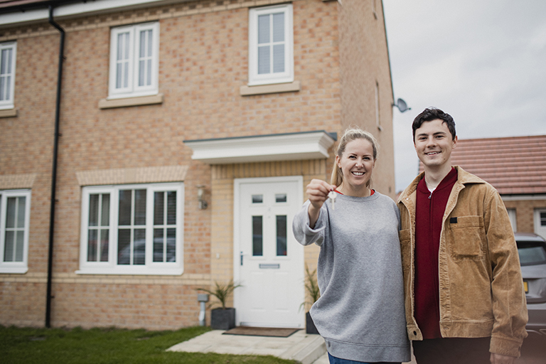 Couple moving in with keys